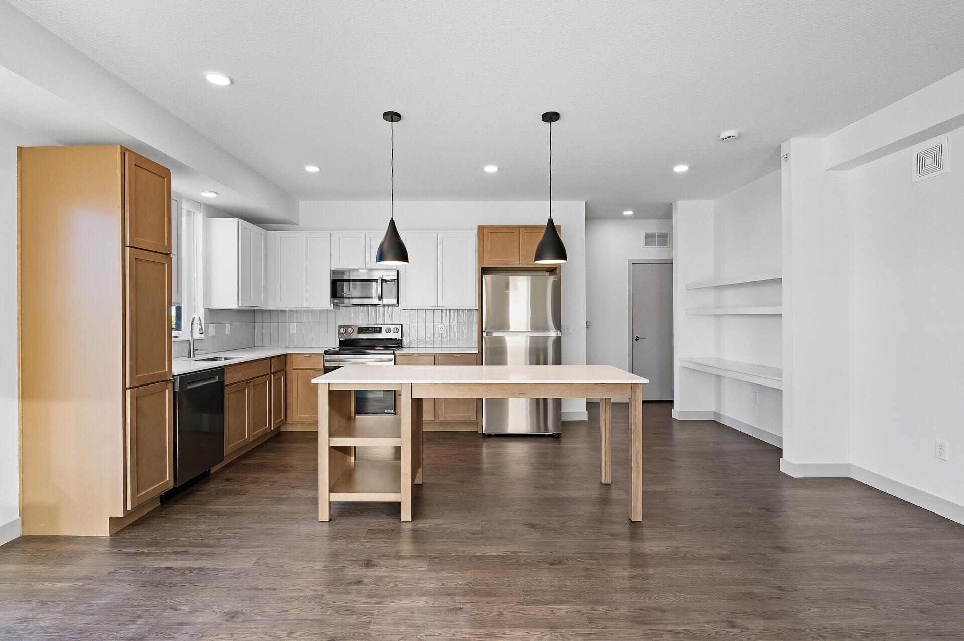 Modern kitchen with wood flooring and island