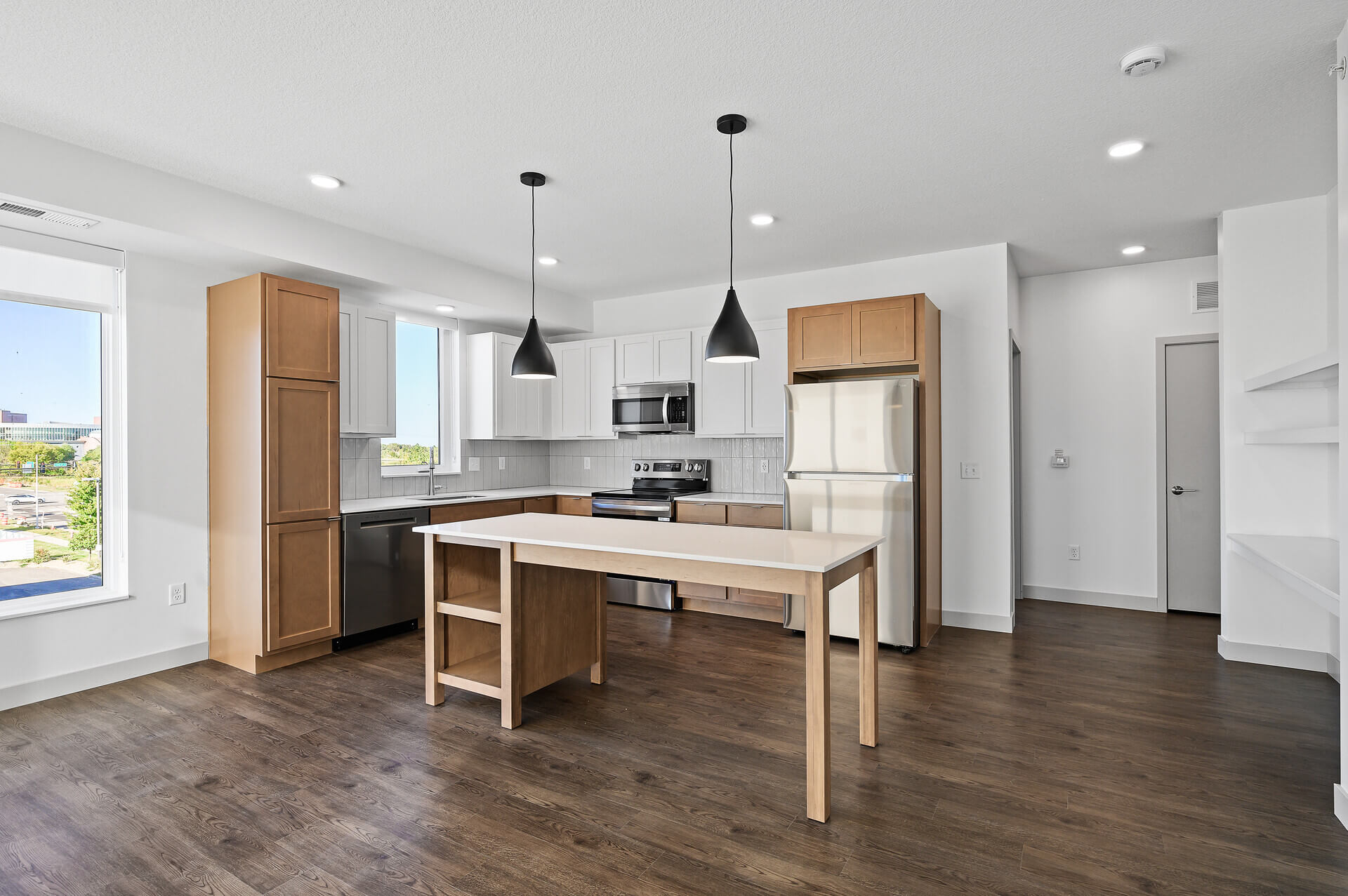 Bright kitchen with open space and large windows