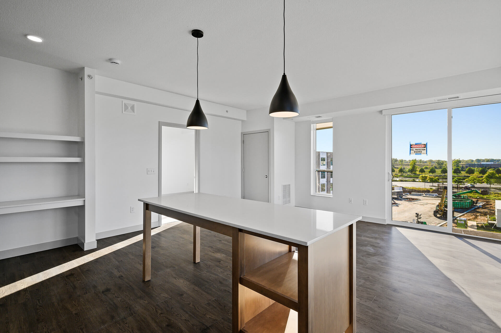 Open-concept kitchen with large island and natural light from large windows