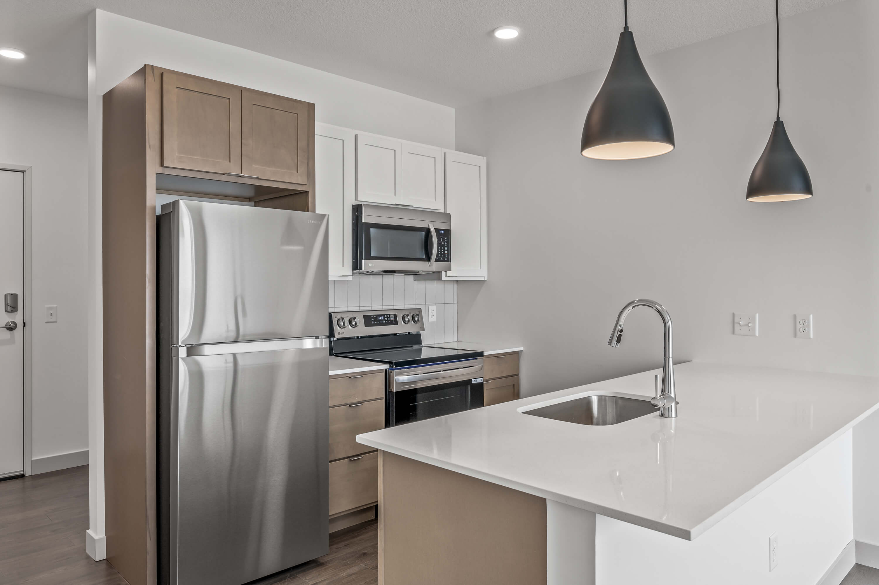 Side view of the kitchen island and sink, highlighting clean lines and modern finishes.