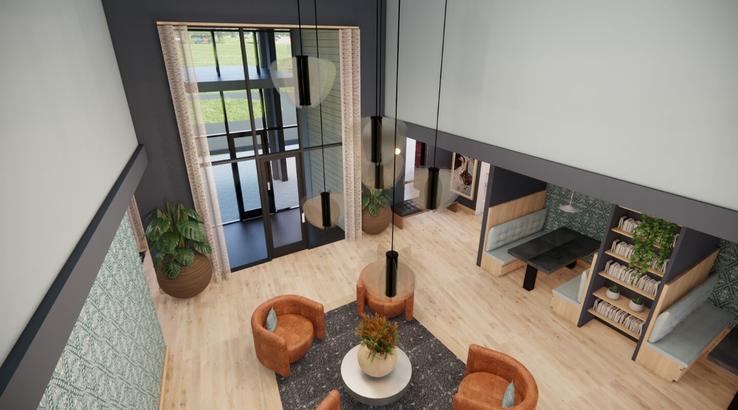 Overhead view of a modern lobby area with velvet armchairs, geometric shelving units, and large mirrors reflecting the space.