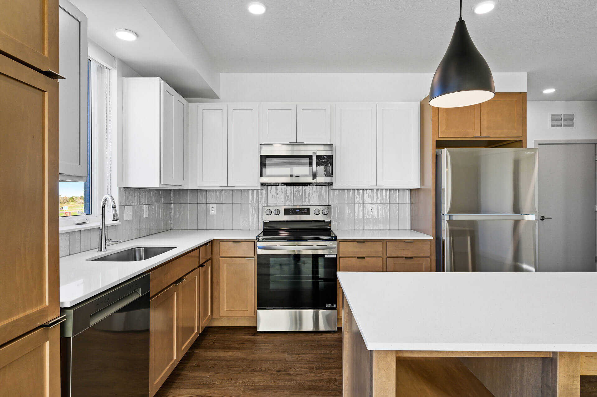 Kitchen island with modern lighting fixtures