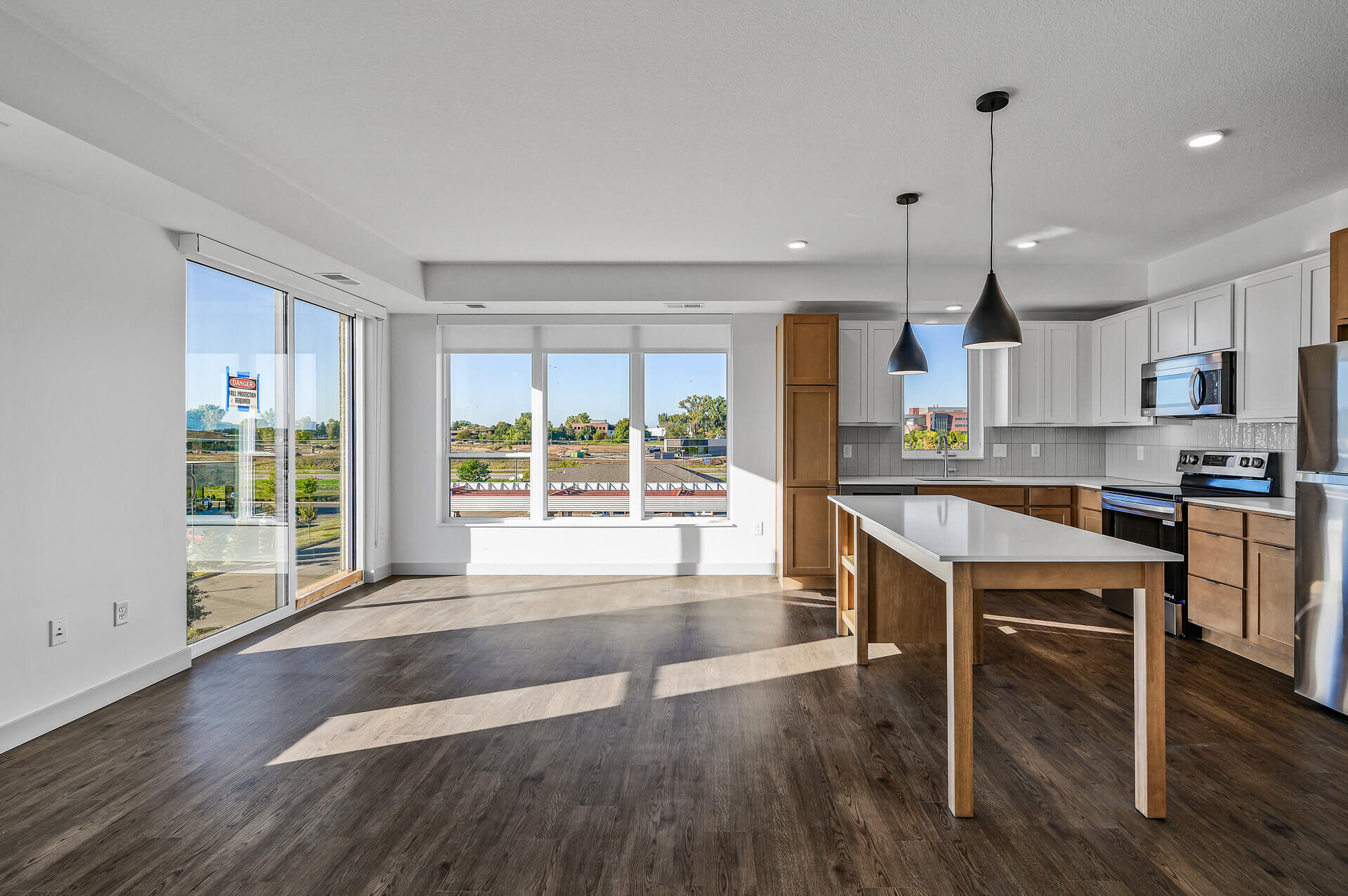 Bright kitchen and living area with large windows